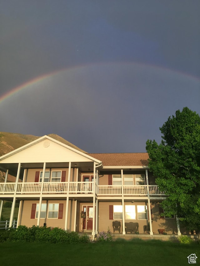 4306 Elk Ln, Erda, UT 84074 - back of house featuring a balcony and a lawn