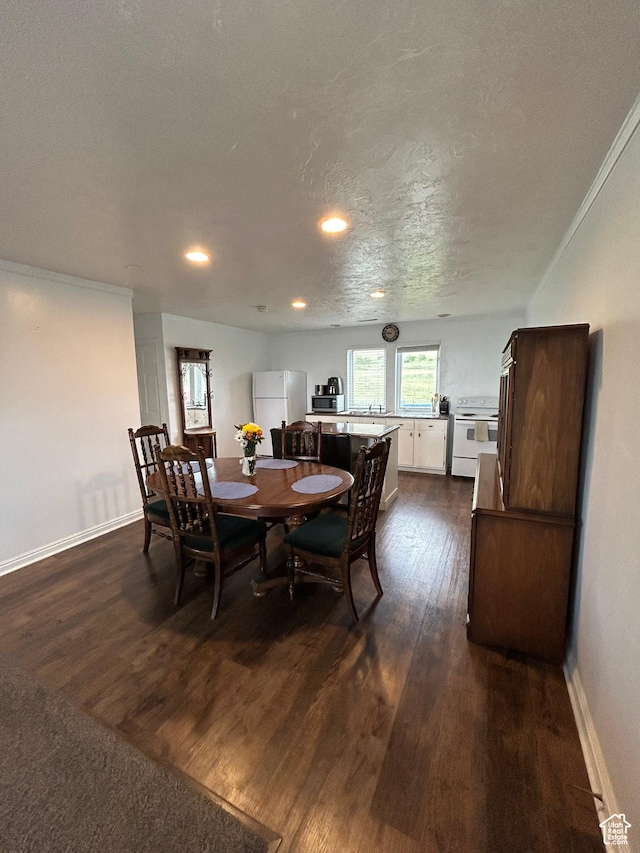 4306 Elk Ln, Erda, UT 84074 - dining area with dark wood finished floors, baseboards, and recessed lighting