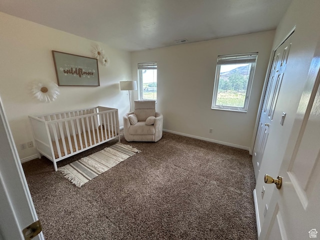 4306 Elk Ln, Erda, UT 84074 - bedroom featuring carpet, baseboards, and a crib