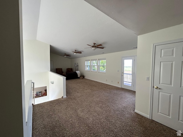 4306 Elk Ln, Erda, UT 84074 - empty room featuring carpet, vaulted ceiling, ceiling fan, and baseboards