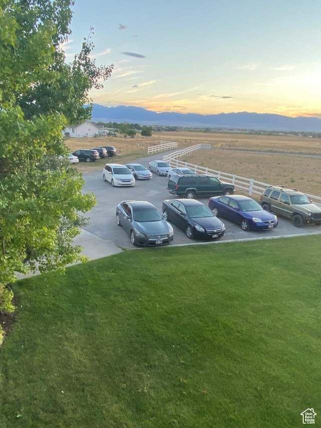 4306 Elk Ln, Erda, UT 84074 - parking at dusk featuring uncovered parking and a mountain view
