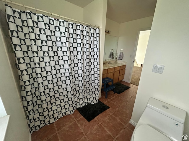 4306 Elk Ln, Erda, UT 84074 - full bathroom with vanity, toilet, tile patterned flooring, and a shower with curtain