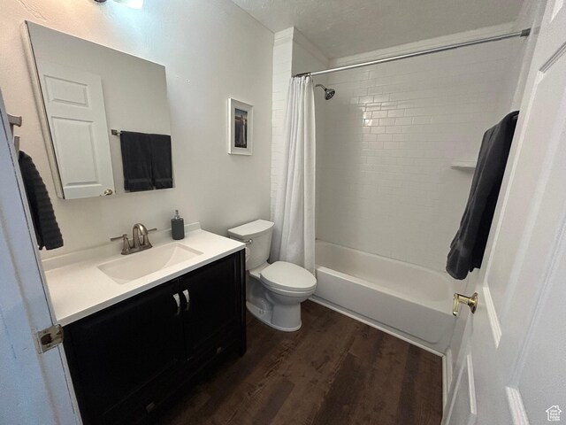 4306 Elk Ln, Erda, UT 84074 - full bathroom with wood finished floors, vanity, toilet, and shower / tub combo