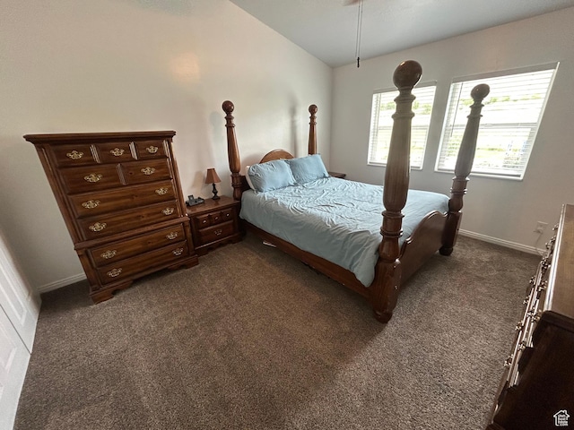 4306 Elk Ln, Erda, UT 84074 - bedroom featuring dark carpet, lofted ceiling, and baseboards