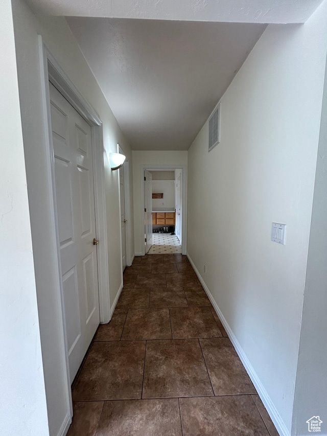 4306 Elk Ln, Erda, UT 84074 - hallway featuring baseboards and tile patterned floors