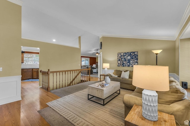 2268 E 10140 S, Sandy, UT 84092 - living area with light wood-style flooring, plenty of natural light, crown molding, a wainscoted wall, and lofted ceiling