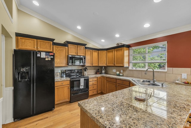 2268 E 10140 S, Sandy, UT 84092 - kitchen featuring black appliances, a sink, lofted ceiling, a peninsula, and ornamental molding