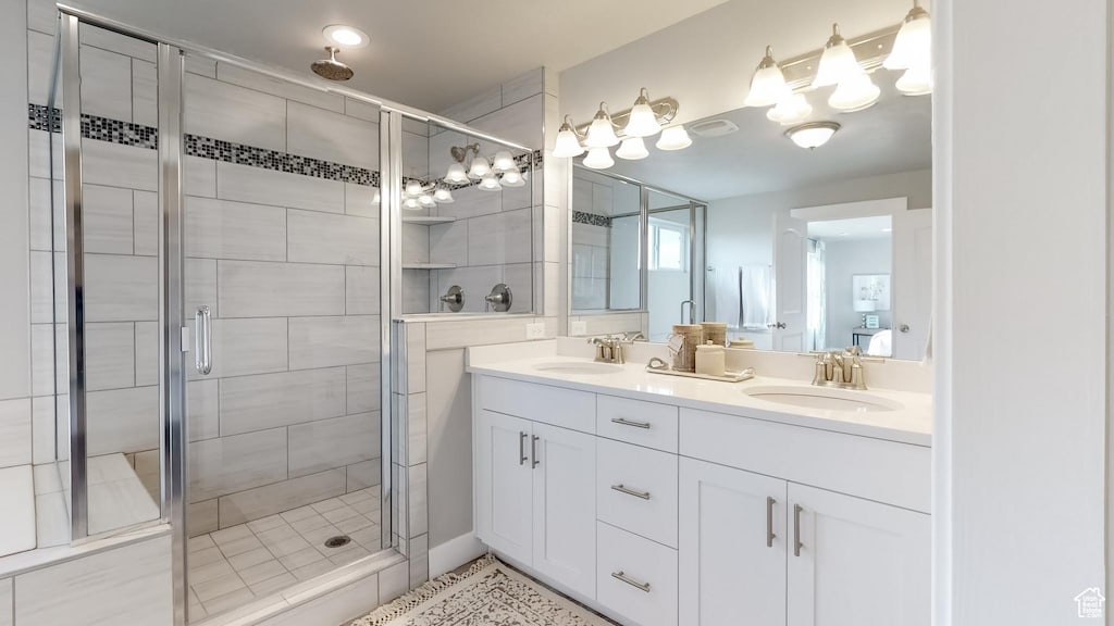5379 N Orville St Unit 428, Eagle Mountain, UT 84005 - bathroom featuring a shower stall, double vanity, and a chandelier