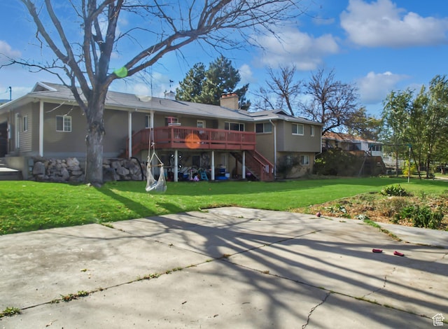 975 S Canyon Breeze E, Draper, UT 84020 - back of property featuring stairway, a chimney, a deck, a lawn, and a patio