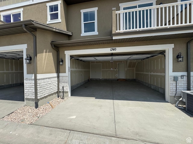 1650 N Main St N Unit 125, Layton, UT 84041 - garage featuring concrete driveway