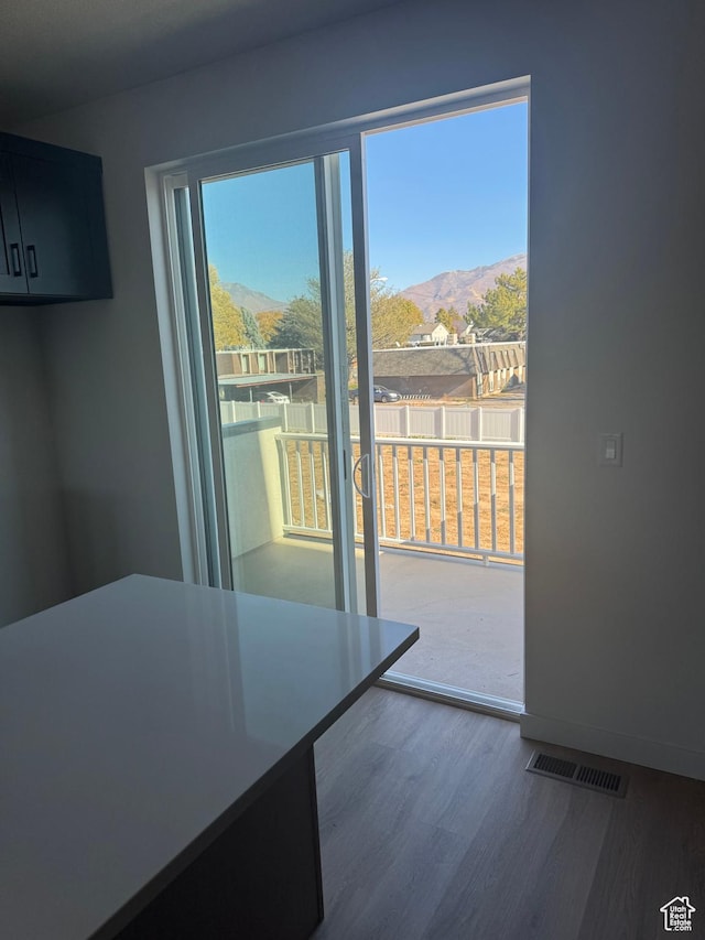 1650 N Main St N Unit 125, Layton, UT 84041 - unfurnished dining area with a mountain view and wood finished floors