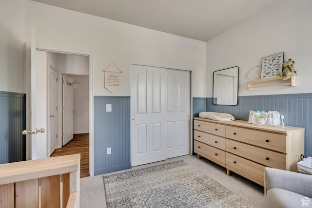 7284 S Brittany Park Ave, West Jordan, UT 84084 - bedroom with wainscoting, a closet, and light wood-style flooring