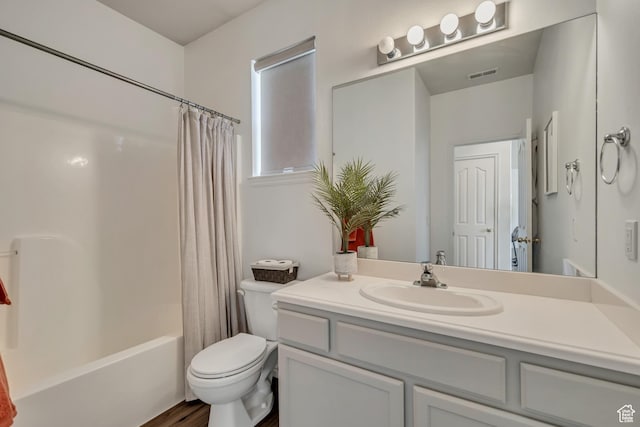 7284 S Brittany Park Ave, West Jordan, UT 84084 - bathroom featuring toilet, vanity, shower / bath combination with curtain, and wood finished floors