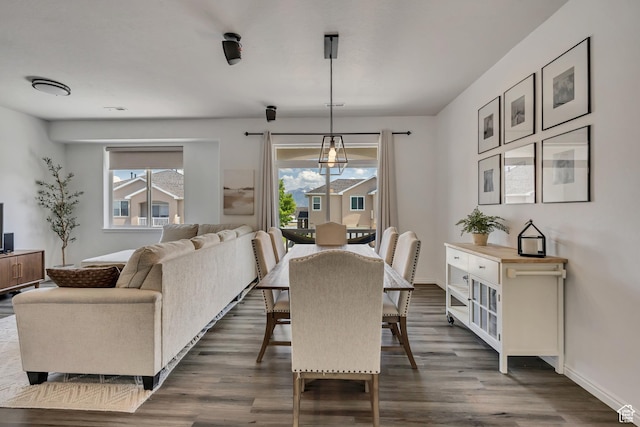 7284 S Brittany Park Ave, West Jordan, UT 84084 - dining area with dark wood-style floors and baseboards