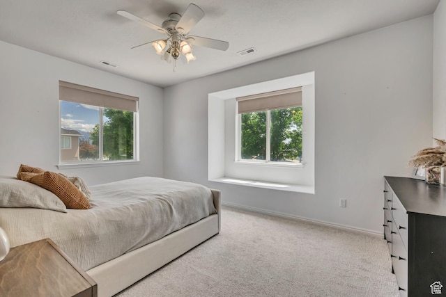 7284 S Brittany Park Ave, West Jordan, UT 84084 - carpeted bedroom featuring multiple windows, baseboards, and ceiling fan