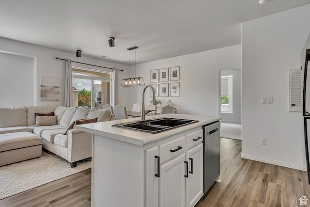 7284 S Brittany Park Ave, West Jordan, UT 84084 - kitchen with a sink, light wood-type flooring, white cabinetry, and stainless steel dishwasher