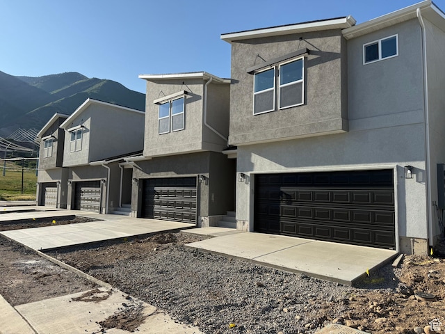 757 W Lone Pine Ln Unit 337, Mapleton, UT 84664 - view of front of property with a garage, stucco siding, and a mountain view