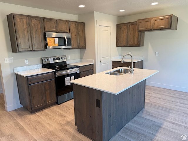 757 W Lone Pine Ln Unit 337, Mapleton, UT 84664 - kitchen with appliances with stainless steel finishes, a sink, light wood finished floors, light countertops, and recessed lighting