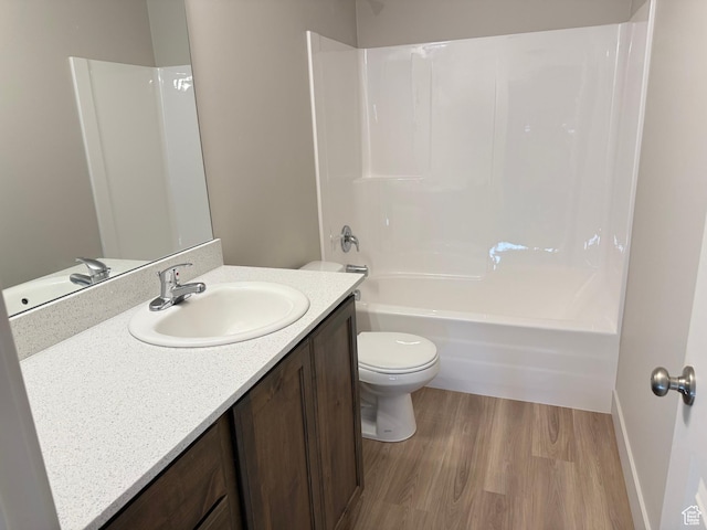 757 W Lone Pine Ln Unit 337, Mapleton, UT 84664 - full bathroom with vanity, toilet, wood finished floors, bathing tub / shower combination, and baseboards
