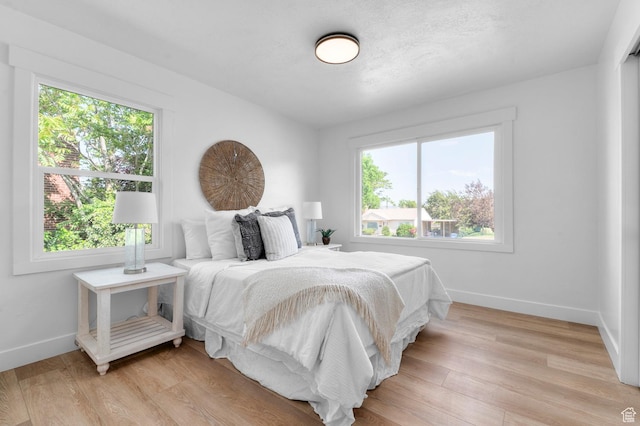 2808 E 3220 S, Millcreek, UT 84109 - bedroom with baseboards and light wood-style flooring