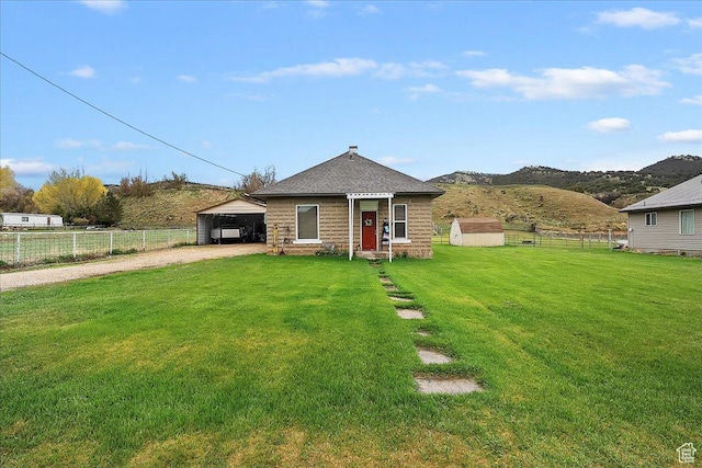 1183 S Hoytsville Rd Unit A, Hoytsville, UT 84017 - view of front of house featuring driveway, a detached carport, and a mountain view