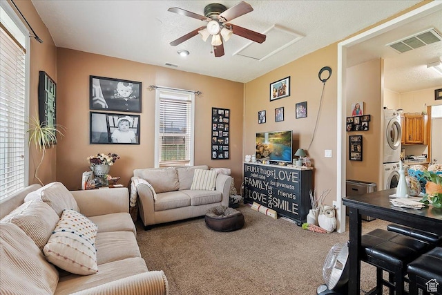 1183 S Hoytsville Rd Unit A, Hoytsville, UT 84017 - living area with stacked washer / drying machine, carpet flooring, a ceiling fan, and a textured ceiling