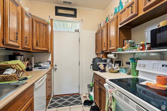 1183 S Hoytsville Rd Unit A, Hoytsville, UT 84017 - kitchen with white appliances, brown cabinetry, light countertops, crown molding, and light tile patterned floors