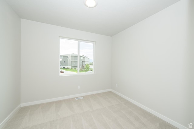 166 N Husker Ln, Saratoga Springs, UT 84045 - spare room featuring baseboards and light colored carpet