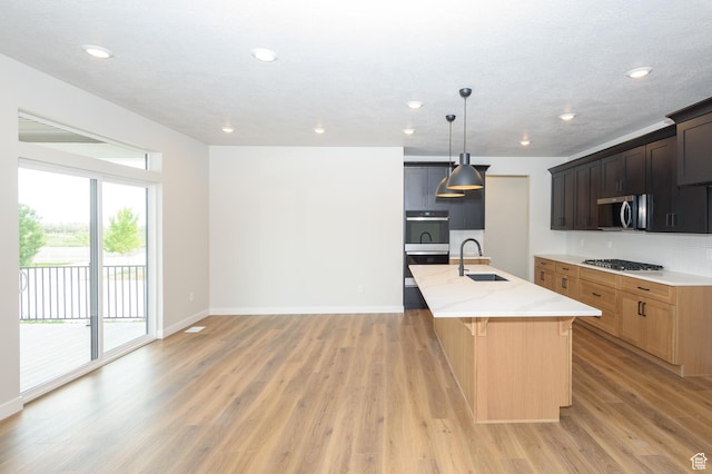 166 N Husker Ln, Saratoga Springs, UT 84045 - kitchen with a sink, healthy amount of natural light, light wood-style floors, and recessed lighting