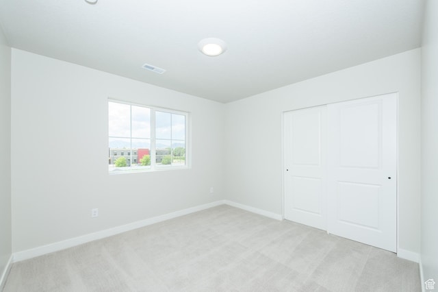 166 N Husker Ln, Saratoga Springs, UT 84045 - unfurnished bedroom featuring light colored carpet, baseboards, and a closet