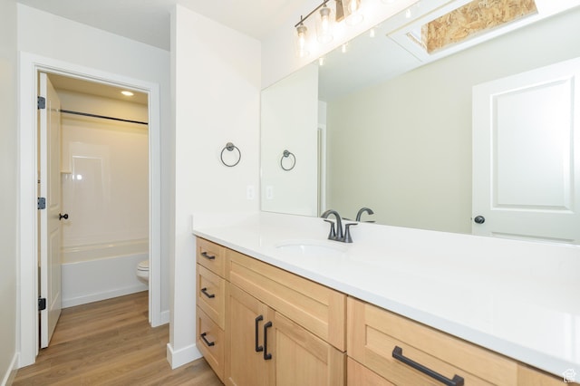 166 N Husker Ln, Saratoga Springs, UT 84045 - full bath with vanity, wood finished floors, toilet, baseboards, and bathing tub / shower combination