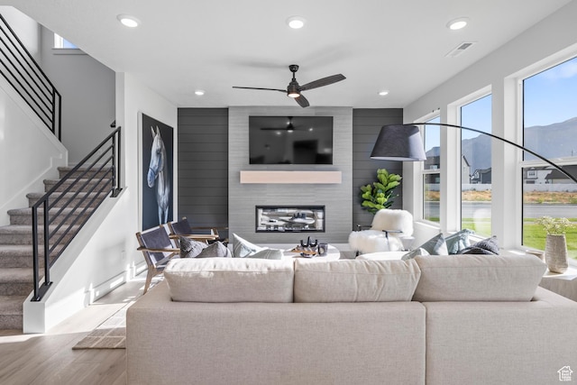 3164 N 3500 W, Plain City, UT 84404 - living room with wood finished floors, recessed lighting, a large fireplace, a ceiling fan, and baseboards