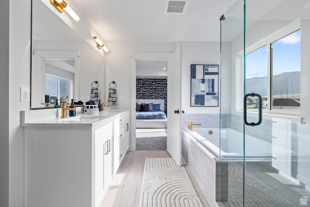 3164 N 3500 W, Plain City, UT 84404 - full bath with ensuite bath, vanity, a garden tub, wood finished floors, and a shower stall
