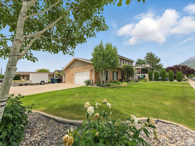 167 N 750 E, Orem, UT 84097 - view of front facade with brick siding, a front lawn, and concrete driveway