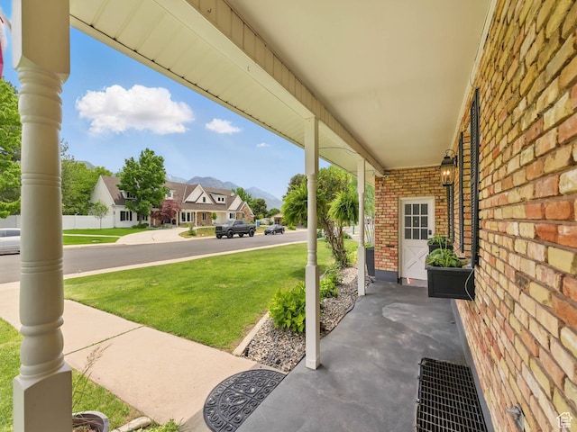 167 N 750 E, Orem, UT 84097 - porch with a lawn, a residential view, and a mountain view
