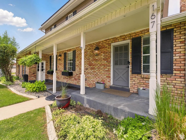 167 N 750 E, Orem, UT 84097 - view of exterior entry featuring covered porch and brick siding