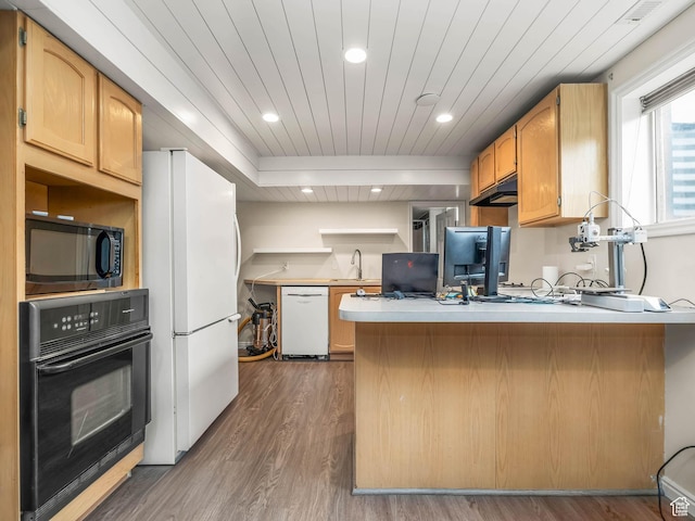 167 N 750 E, Orem, UT 84097 - kitchen with black appliances, a peninsula, a sink, wood finished floors, and light countertops
