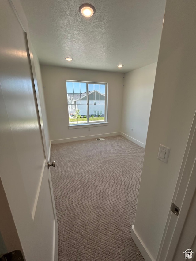 572 N 600 W, Smithfield, UT 84335 - carpeted empty room with baseboards, a textured ceiling, and recessed lighting