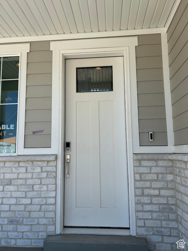 572 N 600 W, Smithfield, UT 84335 - doorway to property featuring brick siding