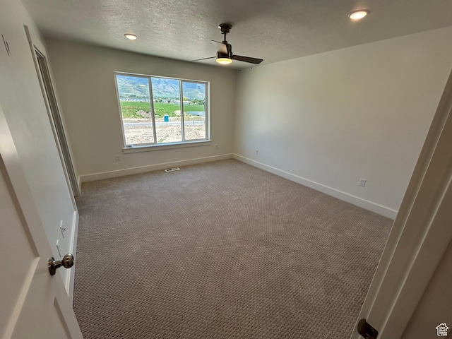 572 N 600 W, Smithfield, UT 84335 - unfurnished bedroom featuring baseboards, light colored carpet, a textured ceiling, a ceiling fan, and recessed lighting