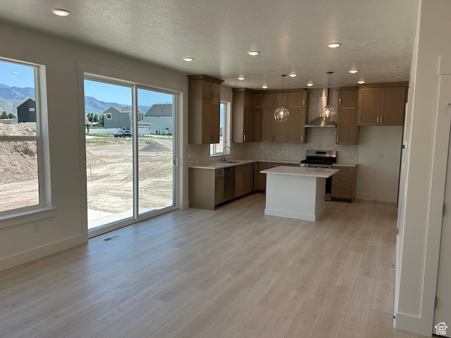 572 N 600 W, Smithfield, UT 84335 - kitchen featuring a sink, appliances with stainless steel finishes, light countertops, decorative backsplash, and baseboards