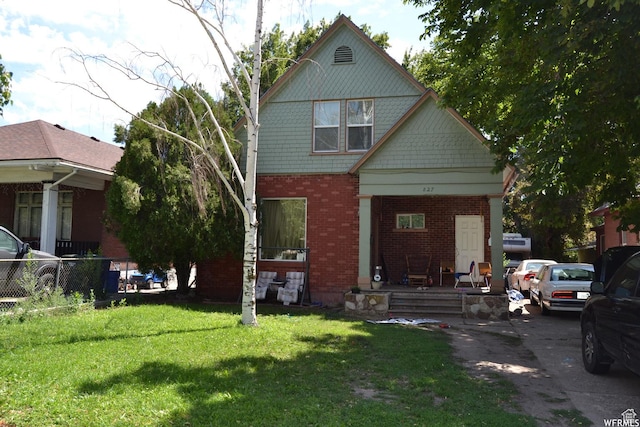 827 E 26th St, Ogden, UT 84401 - view of front of home featuring a porch and brick siding