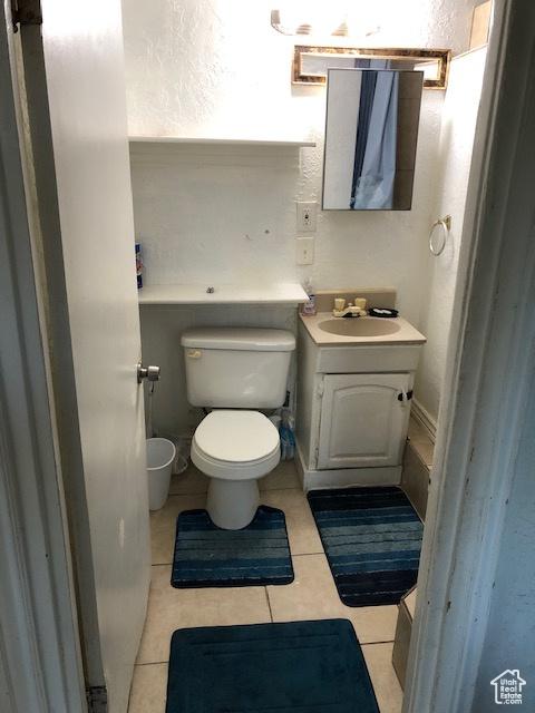 827 E 26th St, Ogden, UT 84401 - bathroom with toilet, vanity, and tile patterned flooring