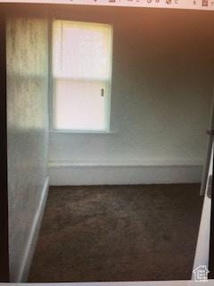 827 E 26th St, Ogden, UT 84401 - carpeted empty room with baseboards