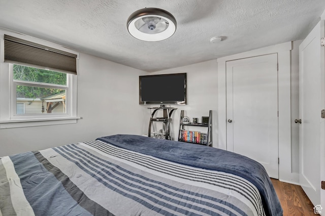 763 E Spring View Dr, Millcreek, UT 84106 - bedroom with a textured ceiling and wood finished floors