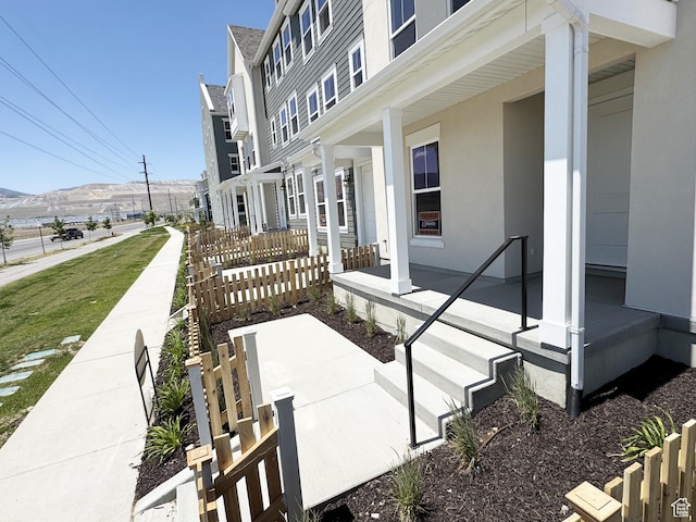 6648 W 11800 S, South Jordan, UT 84009 - view of home's exterior featuring a porch and stucco siding