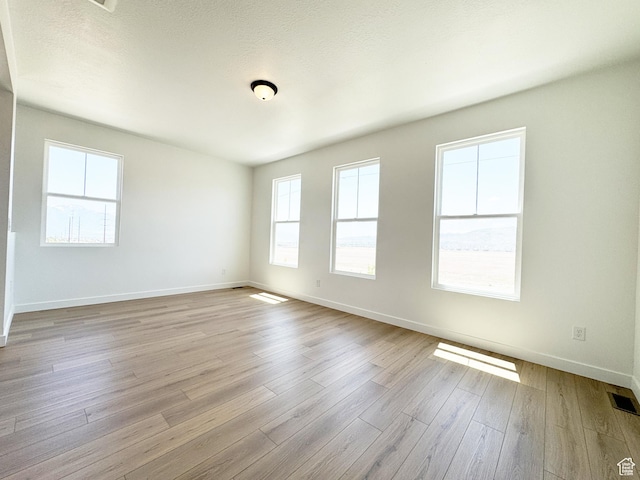6648 W 11800 S, South Jordan, UT 84009 - unfurnished room with baseboards and wood finished floors
