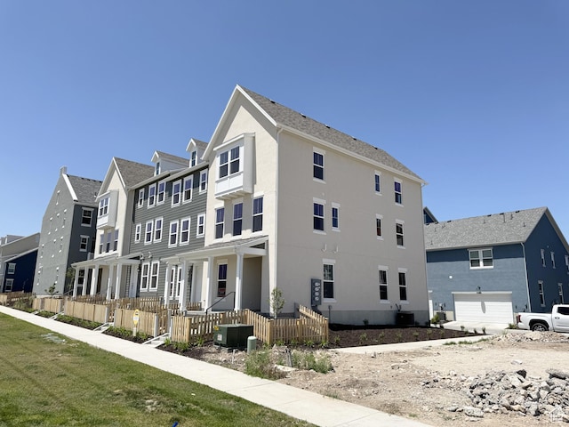 6648 W 11800 S, South Jordan, UT 84009 - view of side of home with stucco siding, a residential view, and a garage