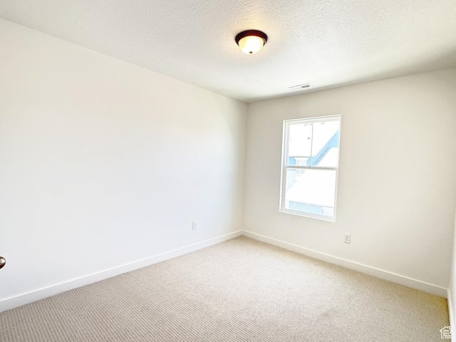 6648 W 11800 S, South Jordan, UT 84009 - spare room featuring light carpet, baseboards, and a textured ceiling