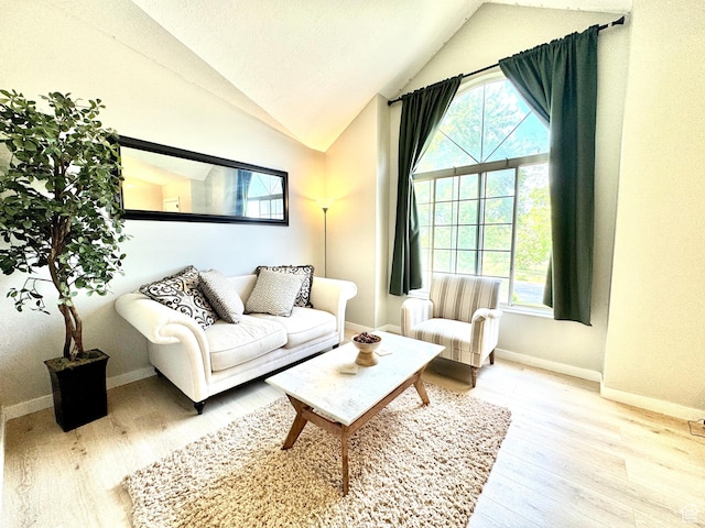 574 N Jackson Ave, Ogden, UT 84404 - living room featuring wood finished floors, lofted ceiling, and baseboards